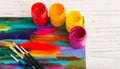 Artist`s workshop.Items for children`s creativity on a wooden background. Acrylic paint and brushes on white wooden background. Pi