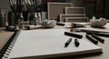 Artist\'s Workspace with Sketchbooks and Drawing Tools Royalty Free Stock Photo