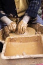 Artist sculpting clay