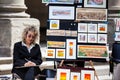 Artist selling her work at the courtyard of the Uffizi Gallery in Florence