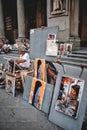 Artist selling his artwork beside the road in Florence