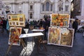 Artist selling paintings on Piazza Navona in Rome