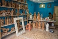 Artist sitting in his tiny shop in San Antonio Ecuador