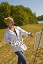 Artist Sizing Up Painting Royalty Free Stock Photo