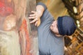 Artist/teacher touching the surface of his artwork Royalty Free Stock Photo