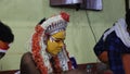 An artist wearing costume for hindu religious performance