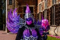 An artist wearing venetian costumes and masks, Brussels Floralia