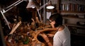 Artist, woman and cutting with wood in workshop for craftsmanship, skill or handmade design with creativity. Woodwork