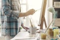 Artist working in the atelier and painting with a spatula Royalty Free Stock Photo