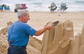 Artist working on beach Royalty Free Stock Photo