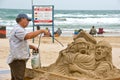 Artist works on beach