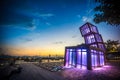 Artistic abstract architecture tower at Kwun Tong Promenade, an urban waterfront park, across skyline and nightscape at sunset Royalty Free Stock Photo