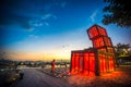 Artistic abstract architecture tower at Kwun Tong Promenade, an urban waterfront park, across skyline and nightscape at sunset Royalty Free Stock Photo