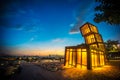 Artistic abstract architecture tower at Kwun Tong Promenade, an urban waterfront park, across skyline and nightscape at sunset Royalty Free Stock Photo