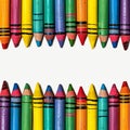 Artistic arrangement crayons form a colorful border on a white surface