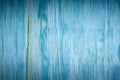 Artistic background of old wooden cracked plywood painted with blue paint