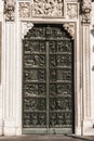 Artistic bronze door of the Milan`s Cathedral Italy Royalty Free Stock Photo