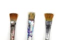 Artistic brushes close up. Watercolor paints in the background. Background with brushes and paints Royalty Free Stock Photo
