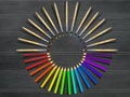 Artistic brushes and colored pencils on wooden table. Tools assortment. Royalty Free Stock Photo