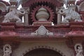 Artistic carving on red and white stone of main gate, bheru tarak dham, rajasthan, I ndia