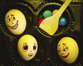 Artistic close-up composition of funny egg family underyellow light feeling for christmas and easter Royalty Free Stock Photo