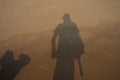 Artistic closeup view of man and dog shadows on the beach