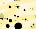 Artistic color brushed yellow paint with black splatters