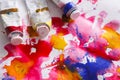 Artistic colorful background. Oil-paint tubes on watercolor drawing Royalty Free Stock Photo