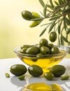 Olives and olive oil and olive leaves floating on a green background Royalty Free Stock Photo