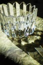 Artistic crystal bowl in back light diffracting light Royalty Free Stock Photo