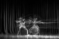 An artistic dancer in a theater shot with a slow shutter speed in order to achieve the desired motion blur Royalty Free Stock Photo