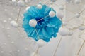 Artistic Depiction of a Blue Flower in Crepe Paper surrounded by a Structure of White Spheres connected Together Royalty Free Stock Photo