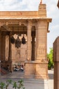 artistic design of palace entrance gate made of red stone at day from flat angle