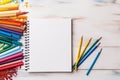 Artistic Desk Layout with Sketchbooks and Pencils