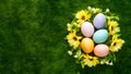 Artistic Easter background with eggs, spring flowers, top view Royalty Free Stock Photo