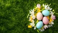 Artistic Easter background with eggs, spring flowers, top view Royalty Free Stock Photo