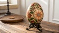 An Artistic Egg with Engraved Patterns Standing Upright on a Wooden Stand Royalty Free Stock Photo