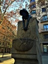 Artistic fountain in Barcelona and boy`s sculpture