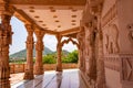 artistic hand carved red stone jain temple at morning from unique angle