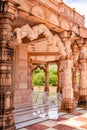 artistic hand carved red stone jain temple at morning from unique angle