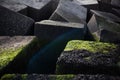 Artistic image of big stoned cubes on the seaside.