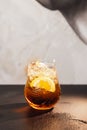 an image of a glass with drinks and slices of lemon