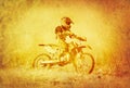 Artistic Image of Off-Road Motorbike Racer on Grunge Background