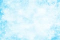 Artistic light blue watercolor background with stains