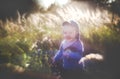 Artistic look portrait of a child in nature, smiling boy