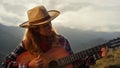 Artistic musician perform guitar song on mountains. Beautiful girl play closeup.