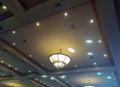 An artistic and mysterious ceiling of an auditorium with an iconic lamp Royalty Free Stock Photo