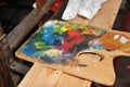 Artistic painter`s wooden palette with colors Royalty Free Stock Photo