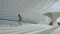 Artistic performer jumping stairs wide shot. Young man contemporary dance alone