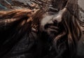 Long hair man swimming with bubble underwater